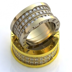 Эксклюзивные обручальные кольца "Bvlgari" из белого и жёлтого сплава с драгоценными камнями в стиле арт - деко